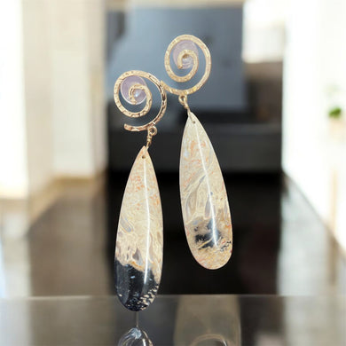 Earrings with petrified palm root