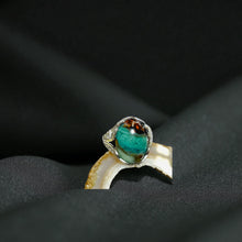 Ring with opalized petrified wood cabochon