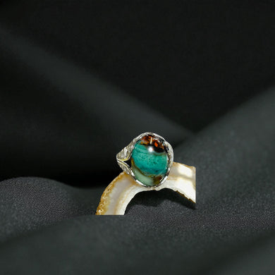 Ring with opalized petrified wood cabochon