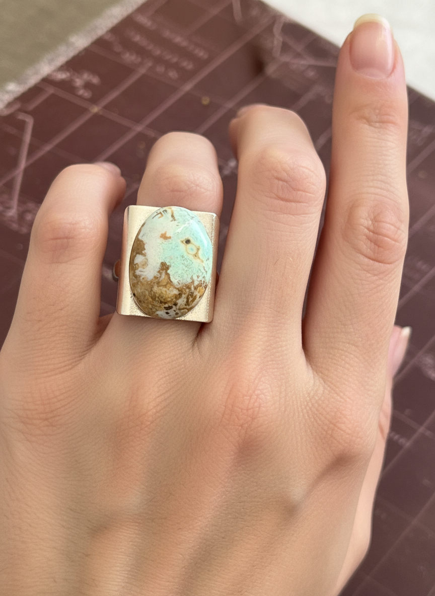 Ring with oval petrified opalized wood cabochon