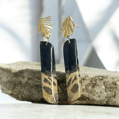 Earrings with petrified palm root