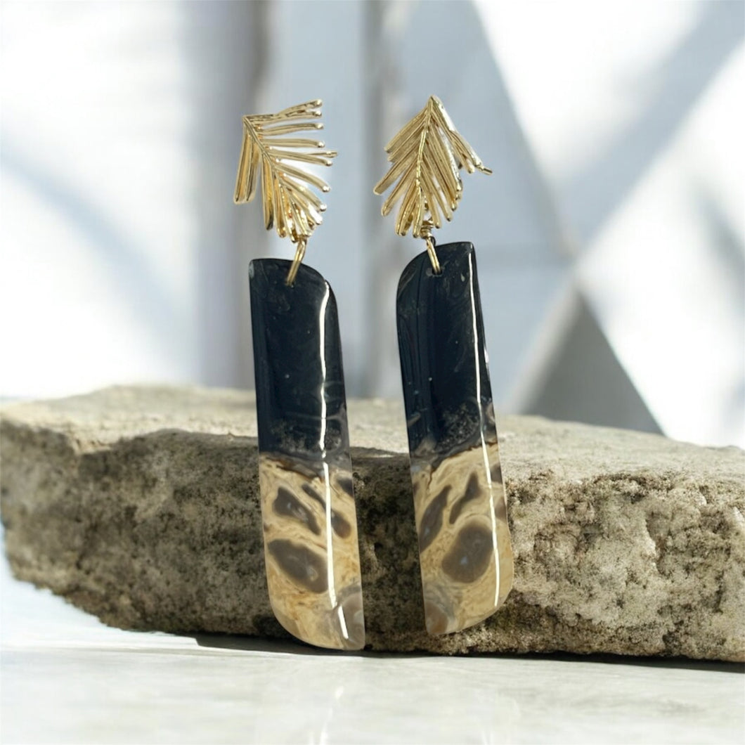 Earrings with petrified palm root