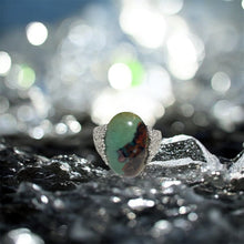 Ring with opalized petrified wood cabochon
