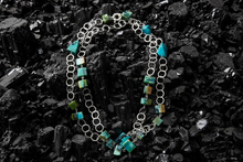 Necklace with chain and opalized wood