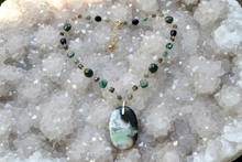 Necklace with opal wood and various stones