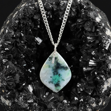 Pendant with light blue colors petrified opalized wood