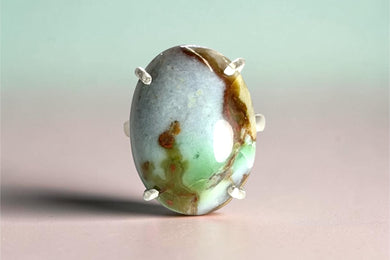 Ring with green petrified opalized wood