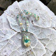 Necklace with opalized wood and various stones