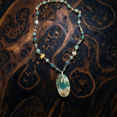 Necklace with opalized wood and various stones