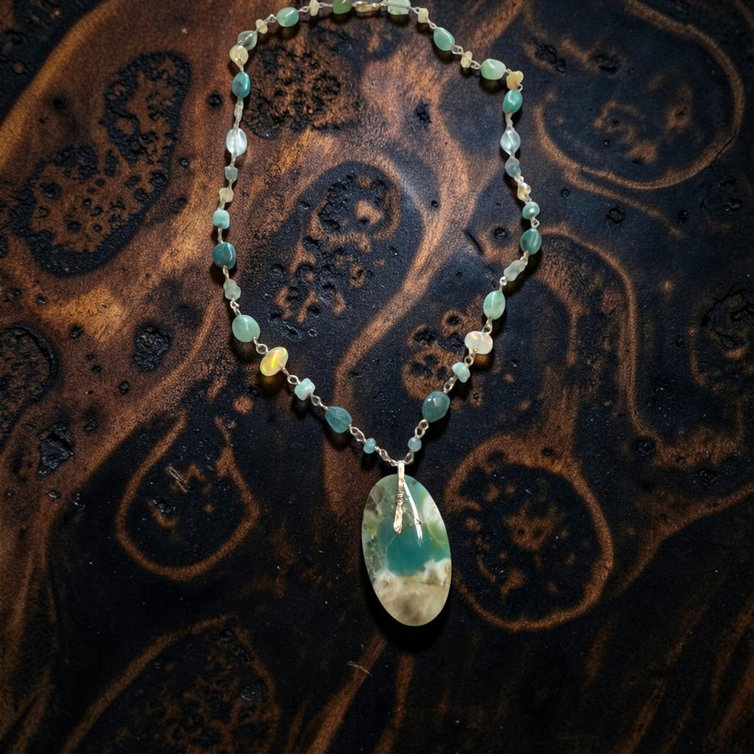 Necklace with opalized wood and various stones