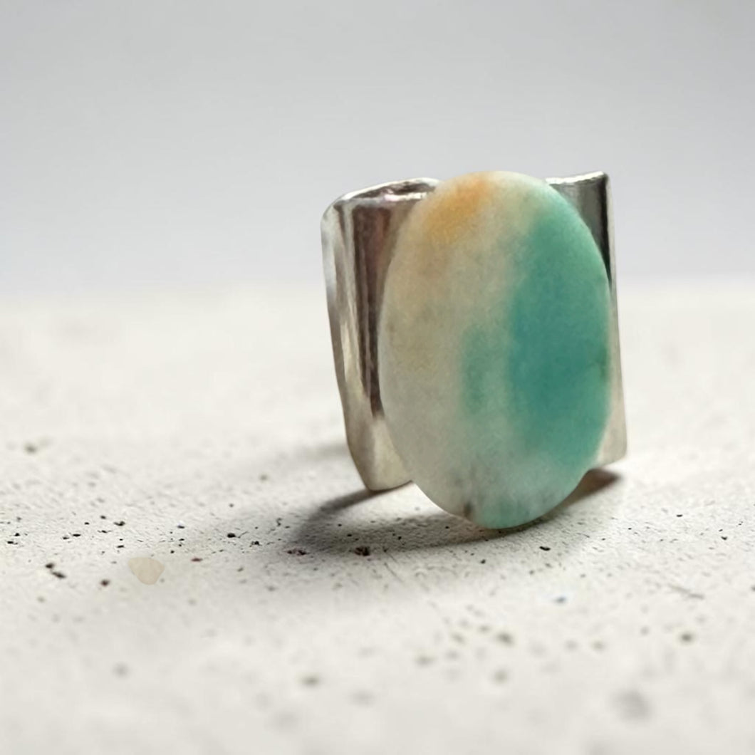 Ring with oval petrified opalized wood cabochon