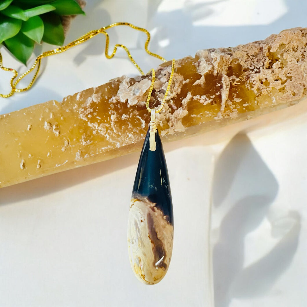 Pendant with petrified palm root