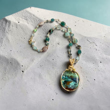 Necklace with opalized wood and various stones