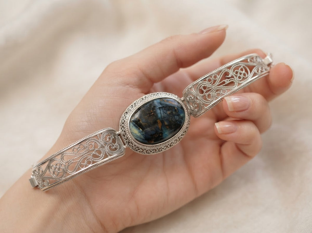 Bracelet cuff in sterling silver with blue petrified wood and copper