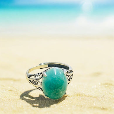 Ring with bright green opalized wood