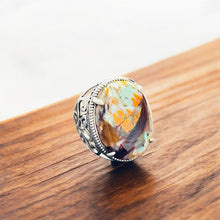 Ring with opalized wood