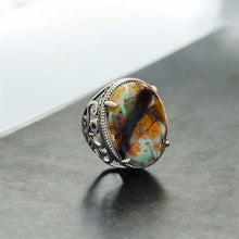 Ring with opalized wood