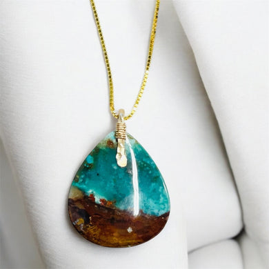 Pendant with black brown blue opalized wood