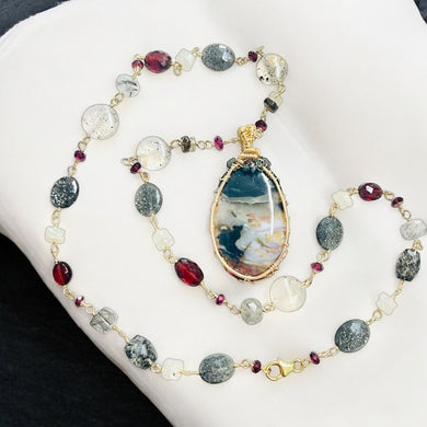 Necklace with dark colors on petrified opalized wood