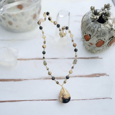 Necklace with petrified palm wood