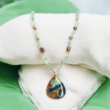Necklace with opal wood and various stones
