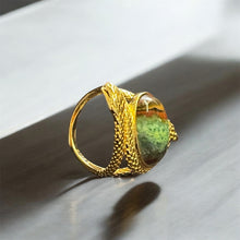 Ring with petrified opalized wood
