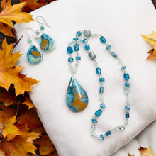 Necklace with multiple colors opalized wood in blue color symphony