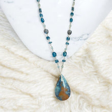 Necklace with multiple colors opalized wood in blue color symphony