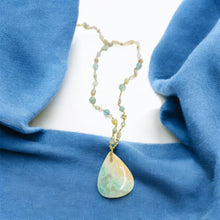 Necklace with light green and white colors opalized wood