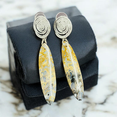 Earrings with petrified palm root