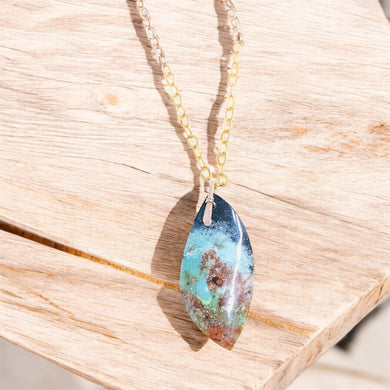 Pendant with petrified opalized cabochon