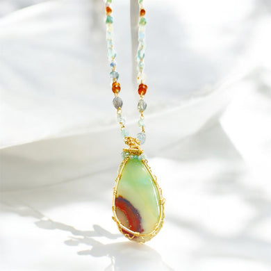 Necklace with light green and white colors opalized wood