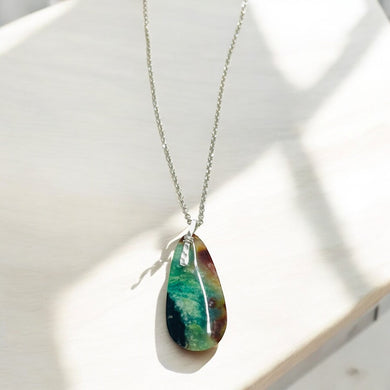 Pendant with dark petrified opalized wood