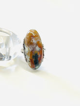 Ring with opalized petrified wood