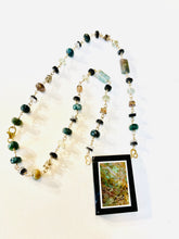 Necklace with intarsia of onyx and opalized wood