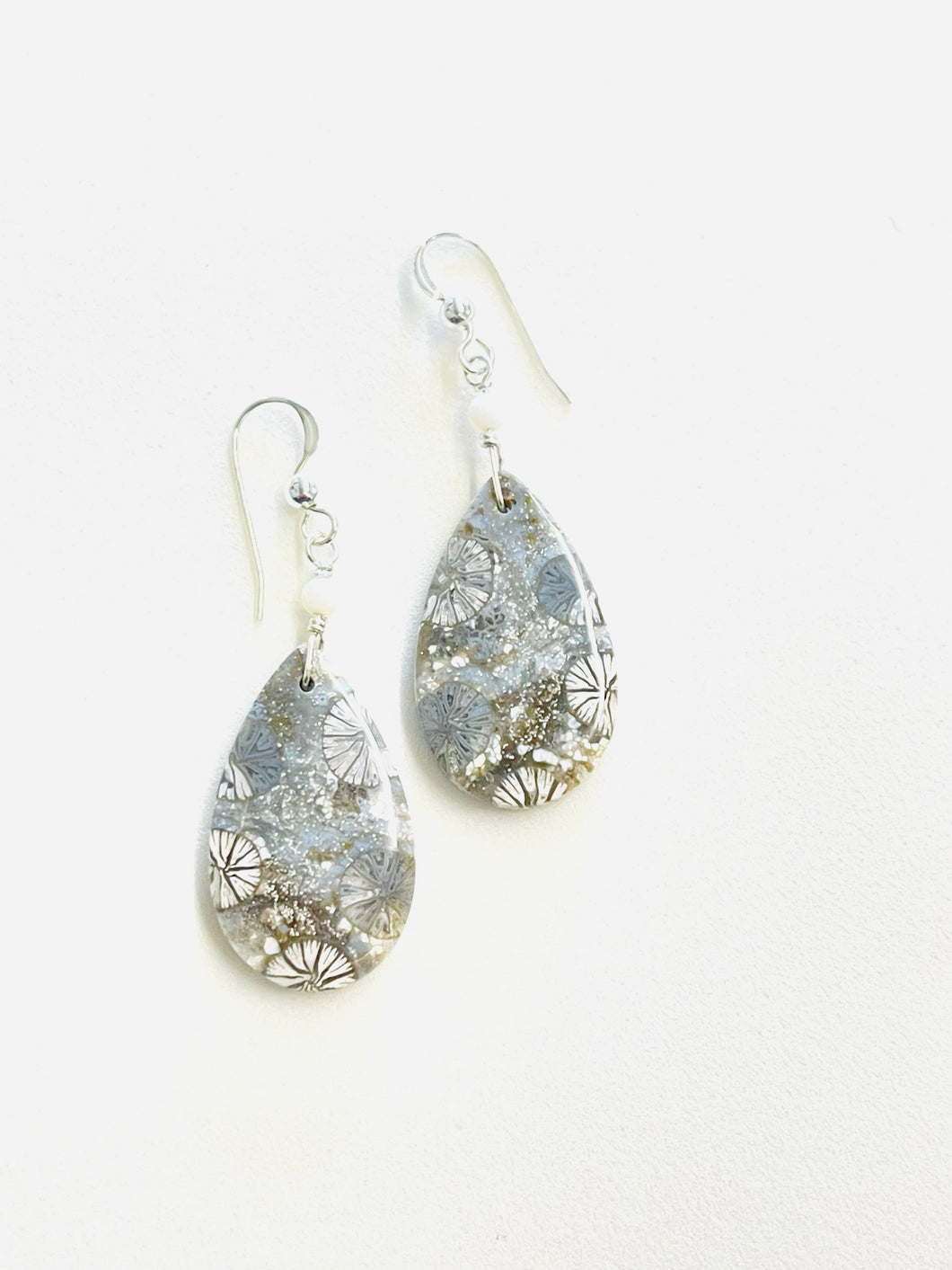 Earrings with grey fossil